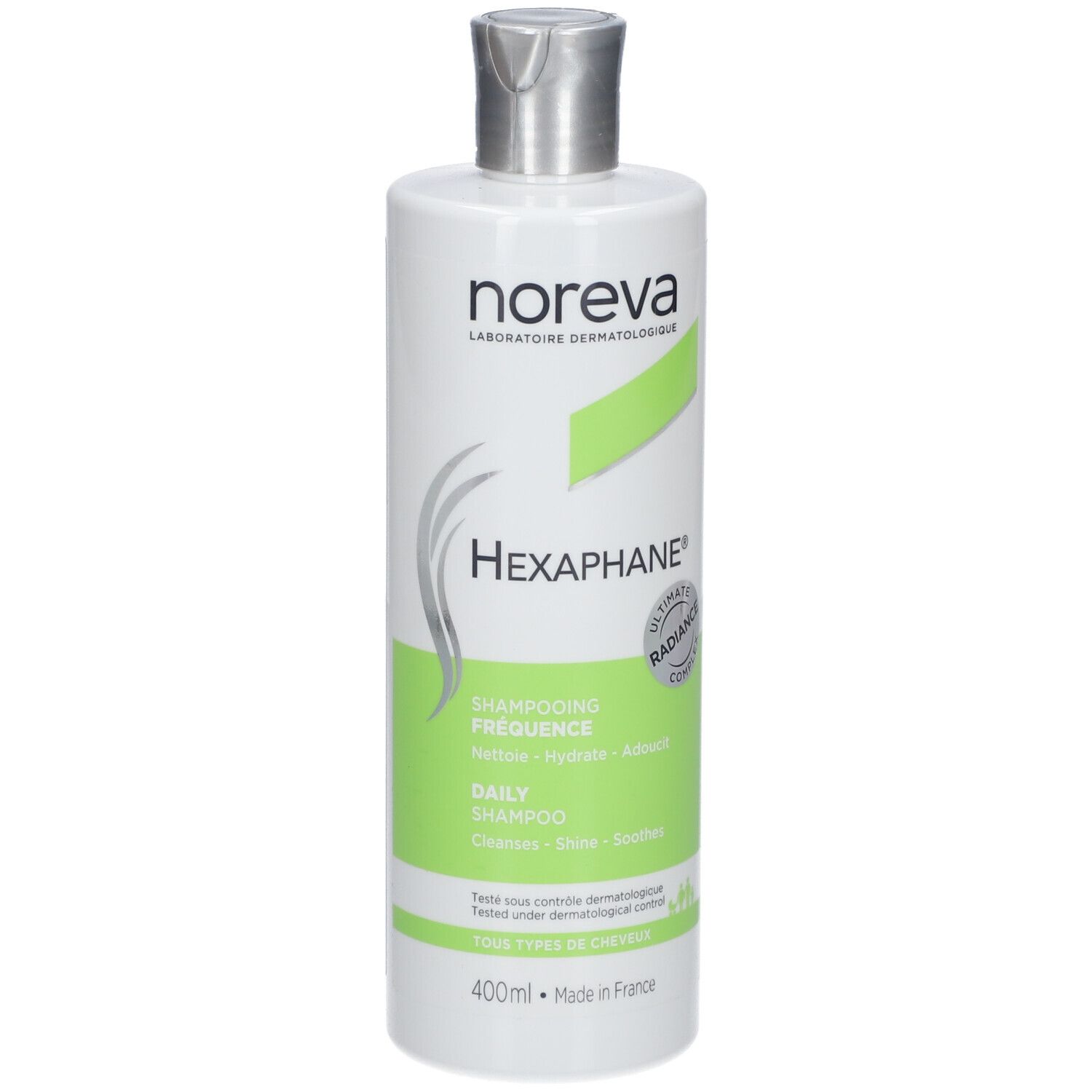 Flacon blanc avec étiquette verte. Inscriptions : noreva, HEXAPHANE®, Shampooing fréquence, Daily Shampoo. 400ml.