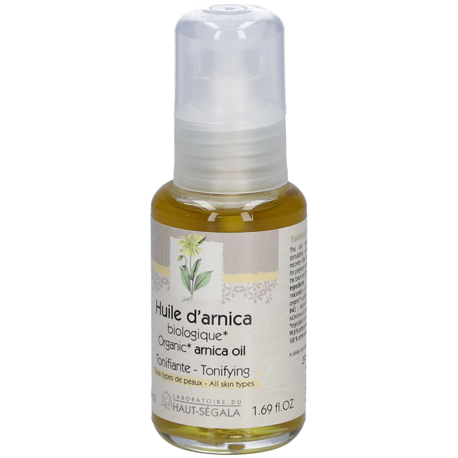 Flacon d'huile d'arnica. Huile jaune dans un flacon en verre avec vaporisateur. Informations sur l'étiquette.