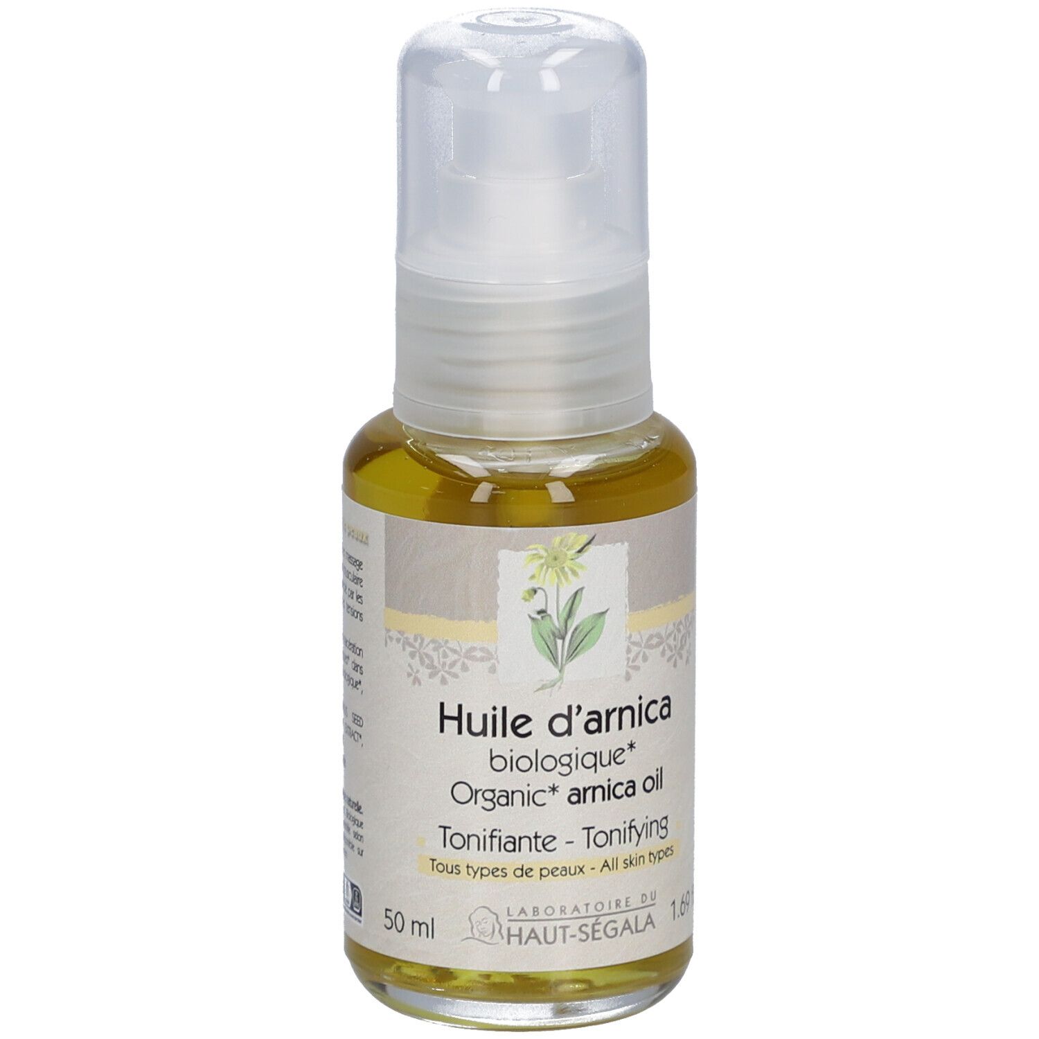 Flacon d'huile d'arnica. Huile jaune dans un flacon en verre avec vaporisateur. Informations sur l'étiquette.