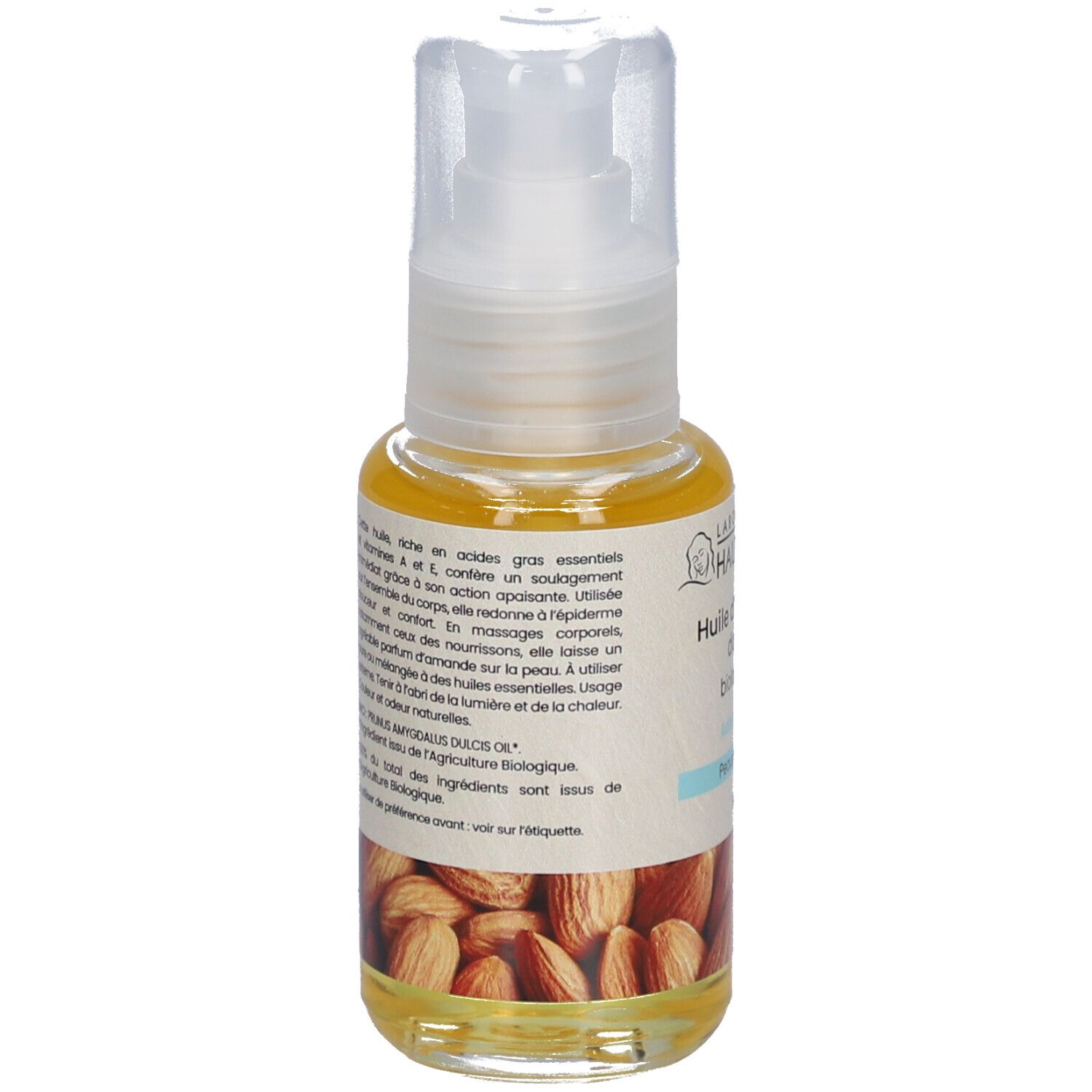 Flacon d'huile avec pompe. Inscription: Huile d'amande douce biologique, Adoucissante, Peaux sensibles. Texte au dos.