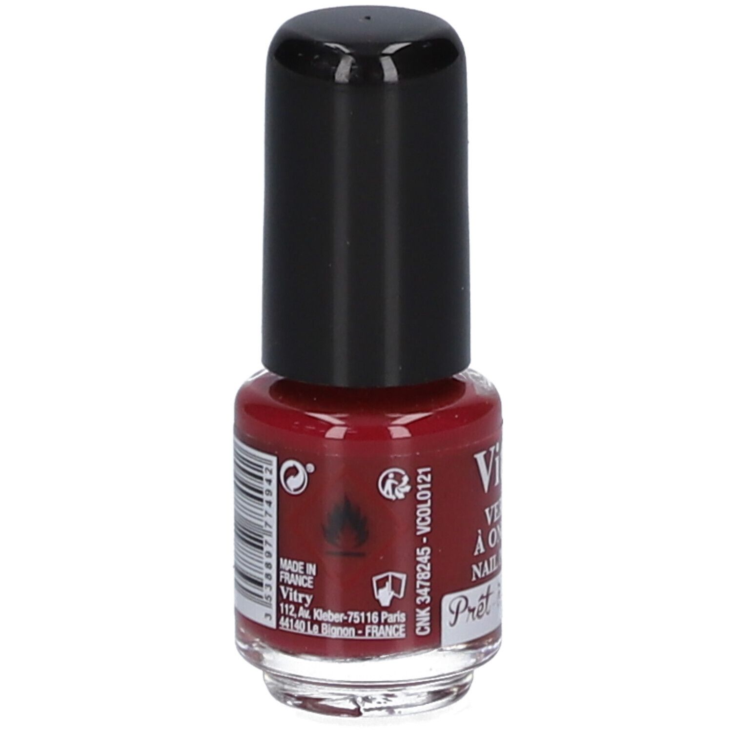 Dos d'un flacon de vernis à ongles. Bouchon noir. Inscriptions: Vitry, adresse, code-barres, avertissements. Liquide rouge visible.