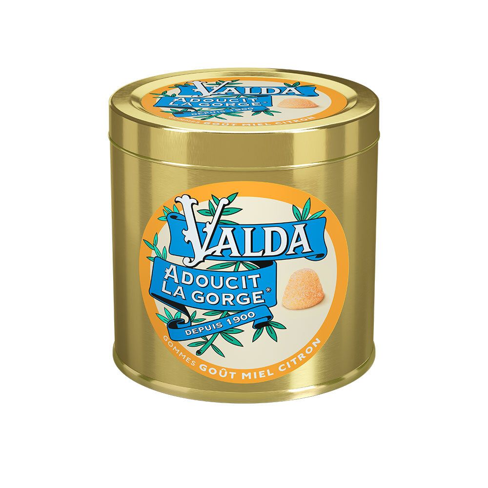 Boîte dorée avec étiquette bleue. Inscription: VALDA, Adoucit la Gorge, Depuis 1900. Image d'un bonbon.