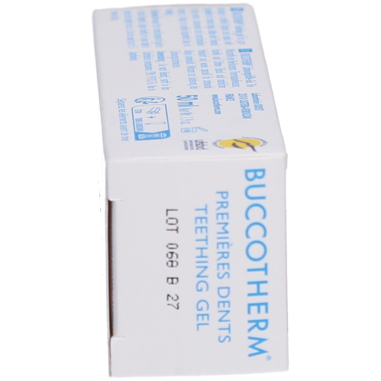 Vue latérale de la boîte de gel de dentition. Nom du produit et numéro de lot. Fond blanc.