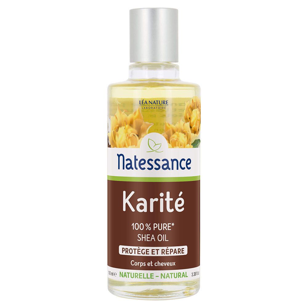 Flacon en verre transparent avec bouchon argenté. Étiquette "Natessance Karité" et "100% Pure Shea Oil".