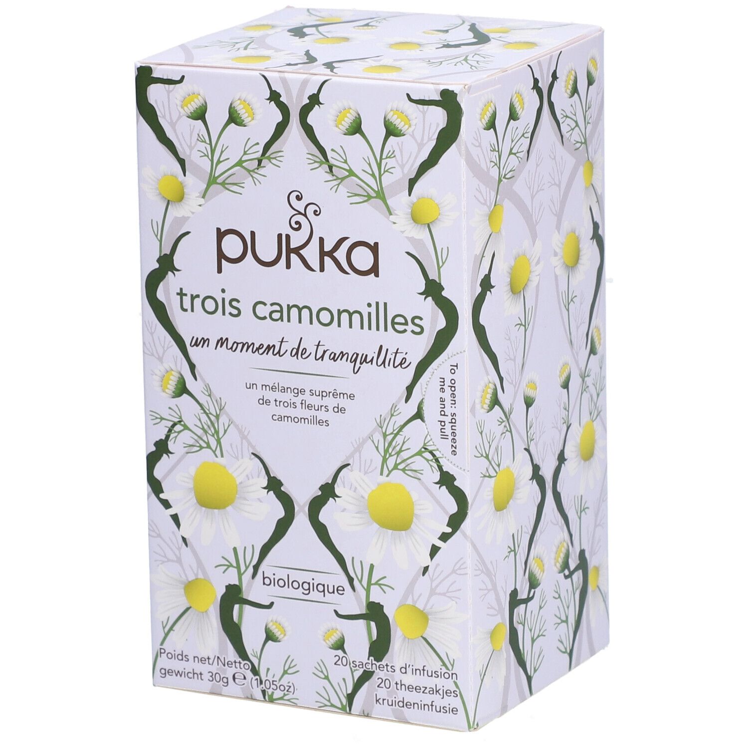 Boîte en carton Pukka Trois Camomilles, motif floral. Inscription: biologique. Contient 20 sachets de thé.