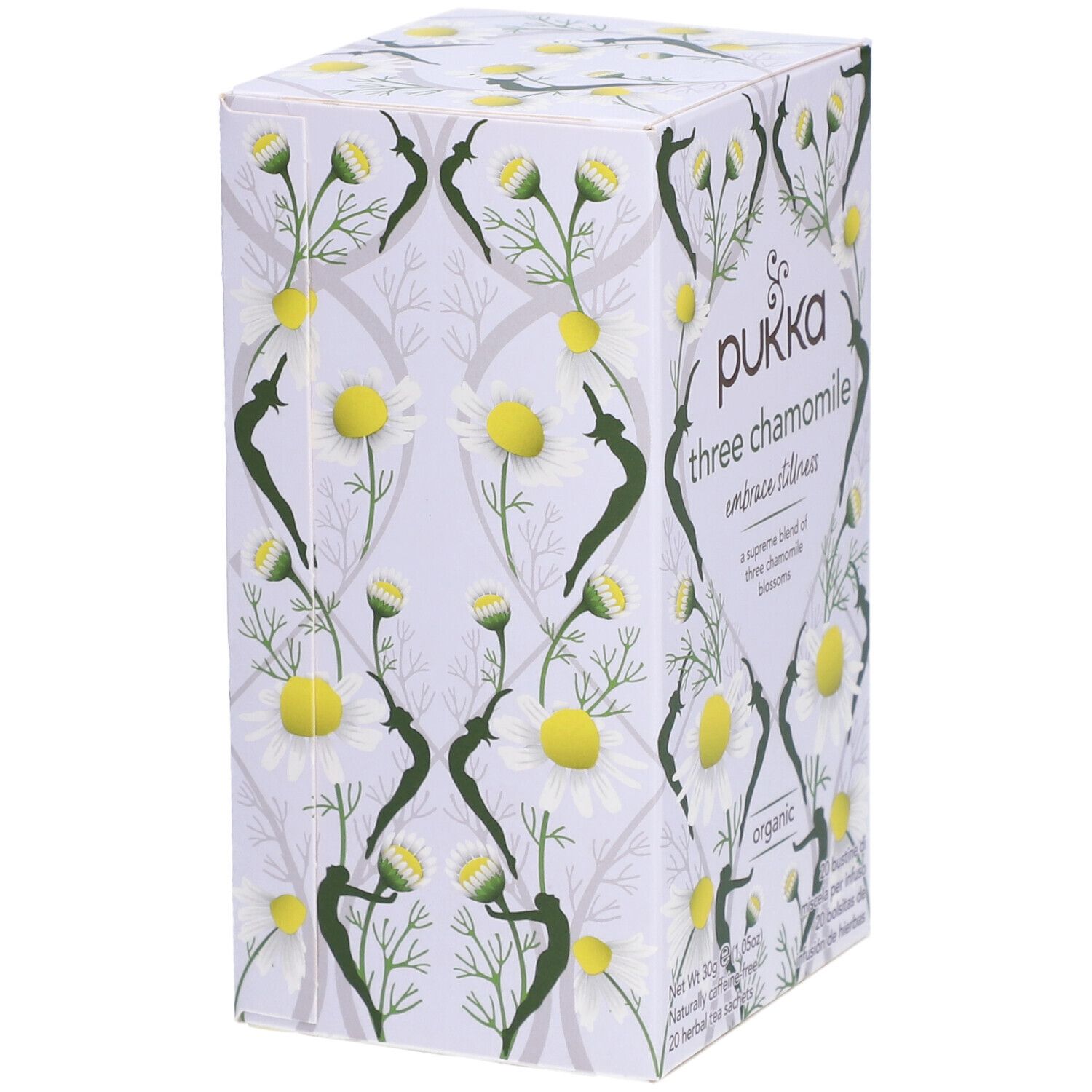 Vue en biais de l'emballage Pukka. Inscription: Pukka, three chamomile, organic. Motif floral de camomille.