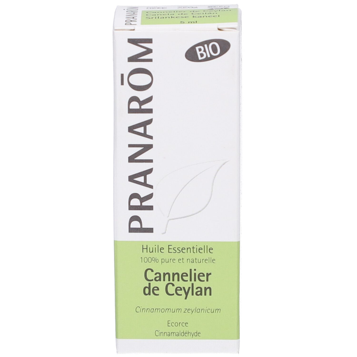 Boîte blanche avec texte: Pranarôm, BIO, Huile Essentielle, Cannelle de Ceylan. Logo feuille.