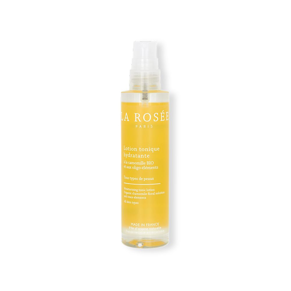 Flacon transparent avec vaporisateur. Liquide jaune. Inscription: LA ROSÉE, Lotion tonique hydratante.