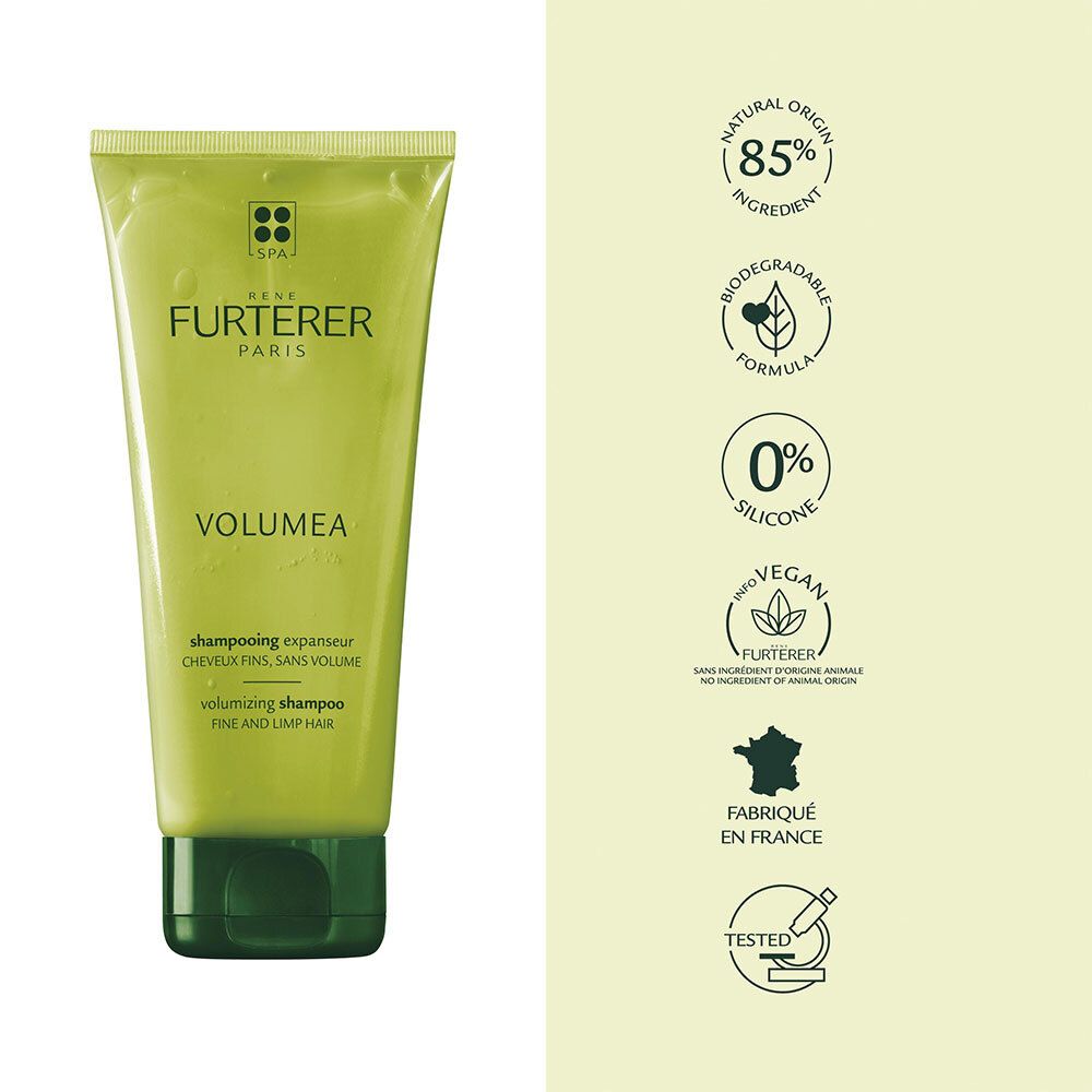 Tube vert de shampooing FURTERER VOLUMEA. Texte et logo. Symboles: 85% naturel, biodégradable, vegan.