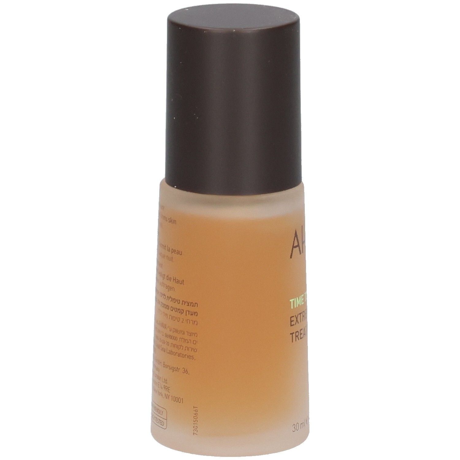 Flacon marron avec bouchon marron. Inscription AHAVA, TIME TO REVITALIZE, EXTREME NIGHT TREATMENT. Texte au dos.