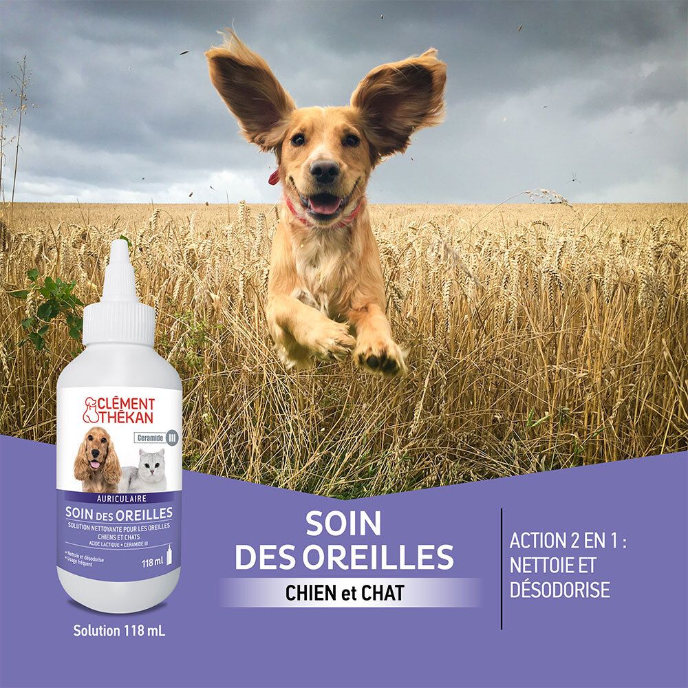 Flacon de produit devant un champ avec un chien sautant. Nom et marque visibles.