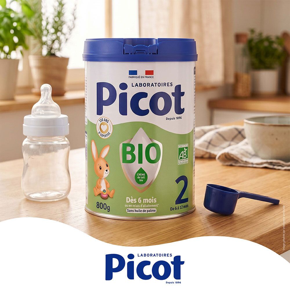 Lait Picot Bio 2ème âge, biberon et cuillère doseuse sur une table en bois.