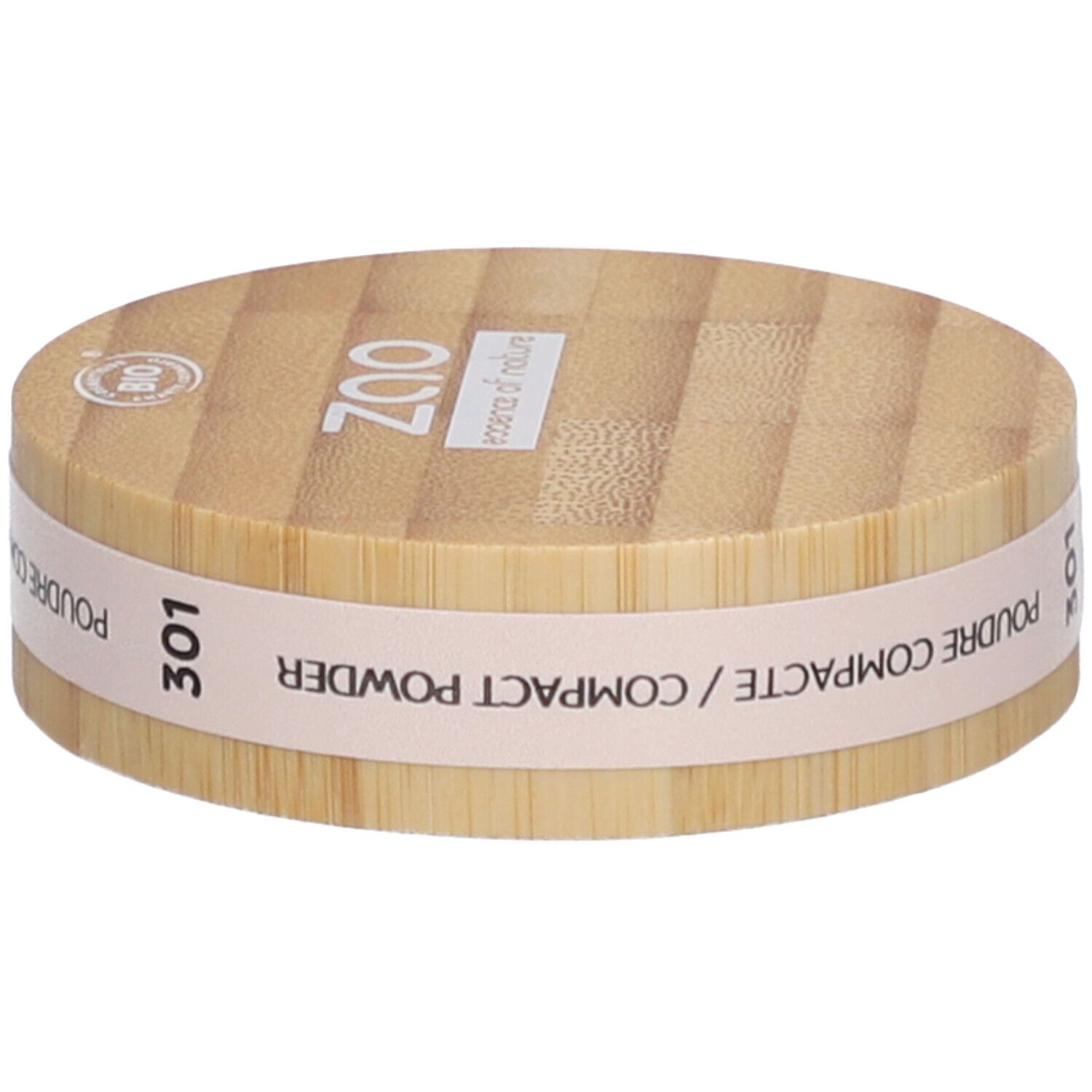 Boîtier de poudre compacte en bois. Inscriptions: ZAO, 301, Poudre Compacte/Compact Powder. Label bio.