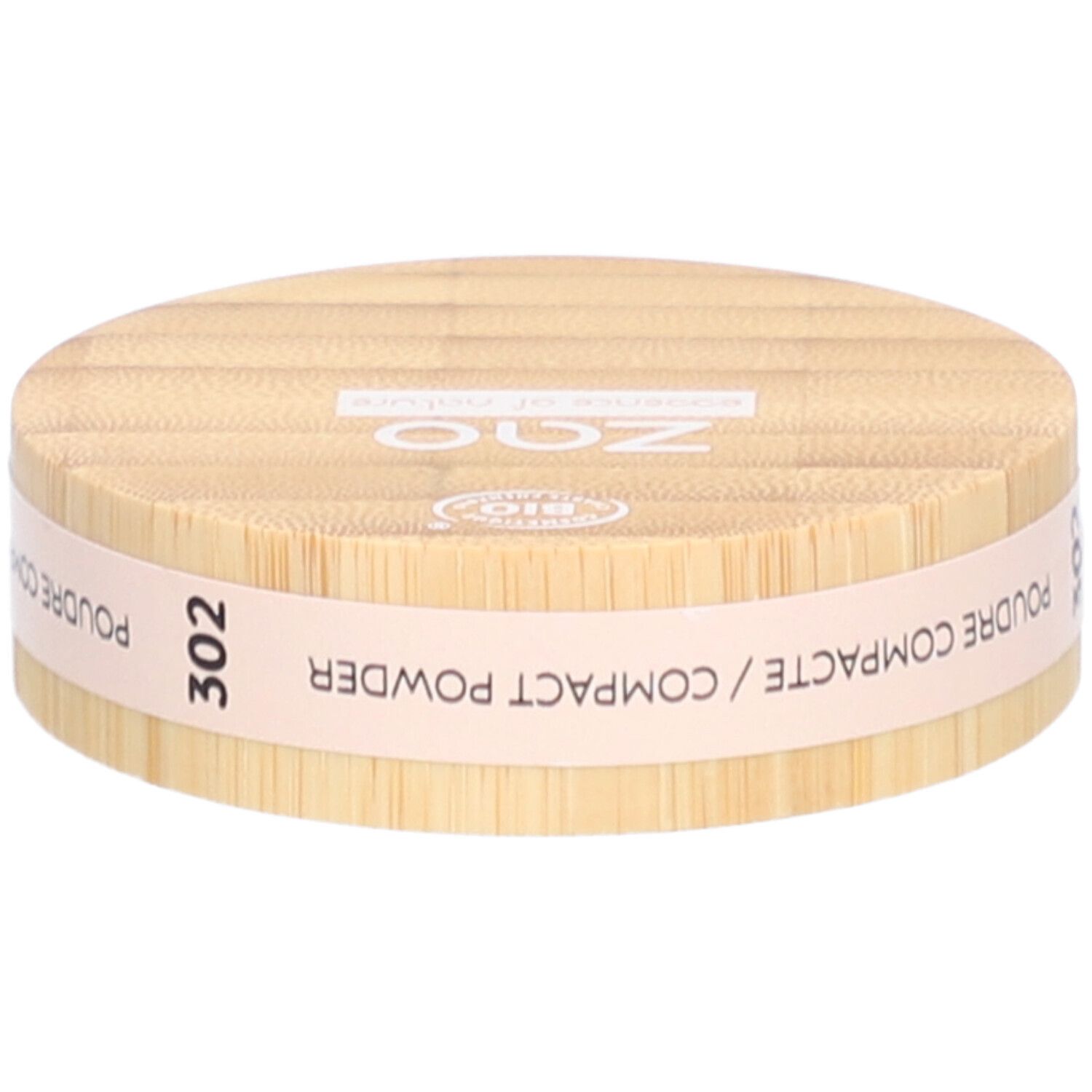 Boîtier rond de poudre compacte en bois. Inscriptions : ZAO, 302, POUDRE COMPACTE. Certification bio.