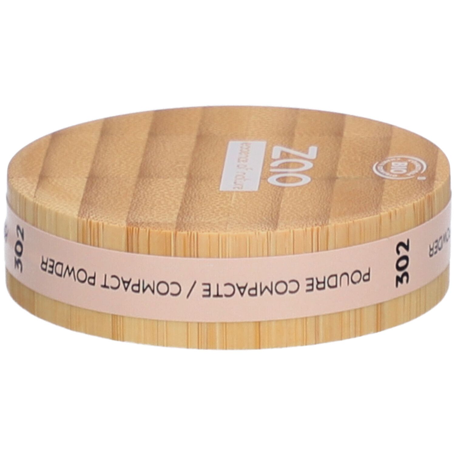 Boîtier rond de poudre compacte en bois. Inscriptions : ZAO, 302, POUDRE COMPACTE. Certification bio.