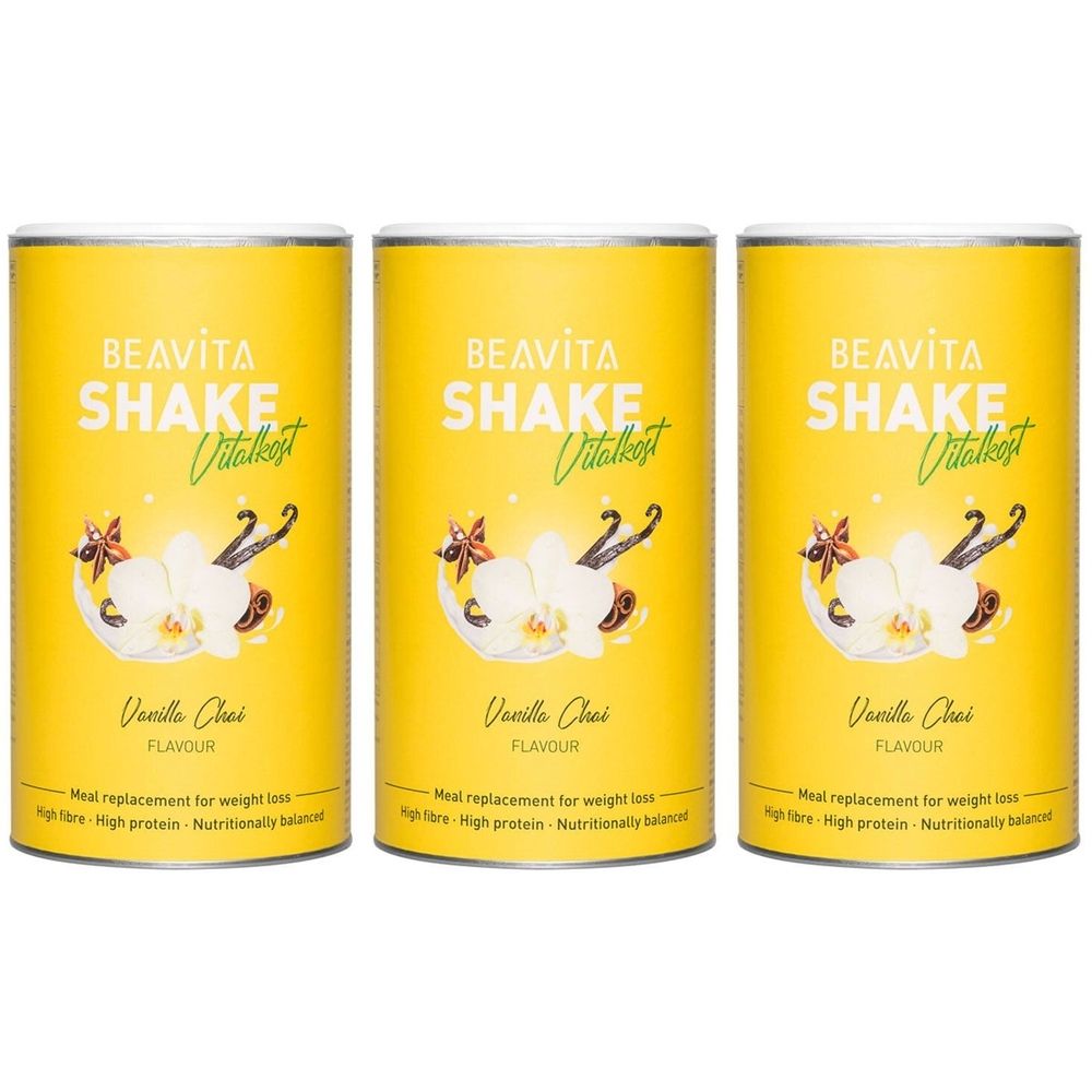 Trois boîtes jaunes avec impression de produit. Inscription: BEAVITA SHAKE Vitalkost, Vanilla Chai. Illustration d'orchidées et de gousses de vanille.
