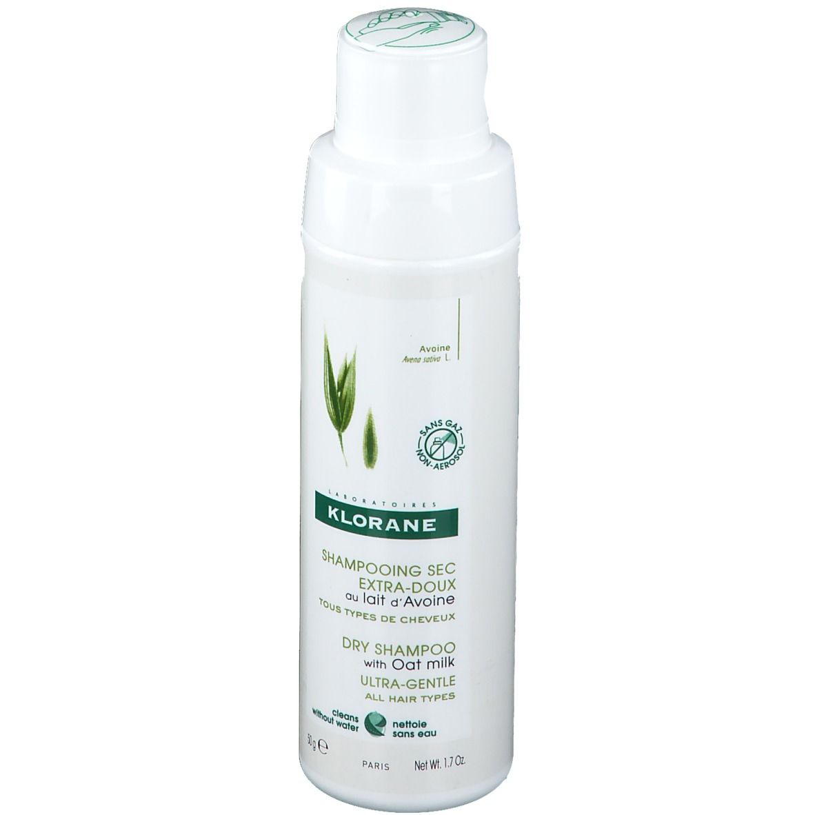 Shampooing sec KLORANE à l'avoine. Flacon blanc, étiquette verte. Inscriptions et logo.