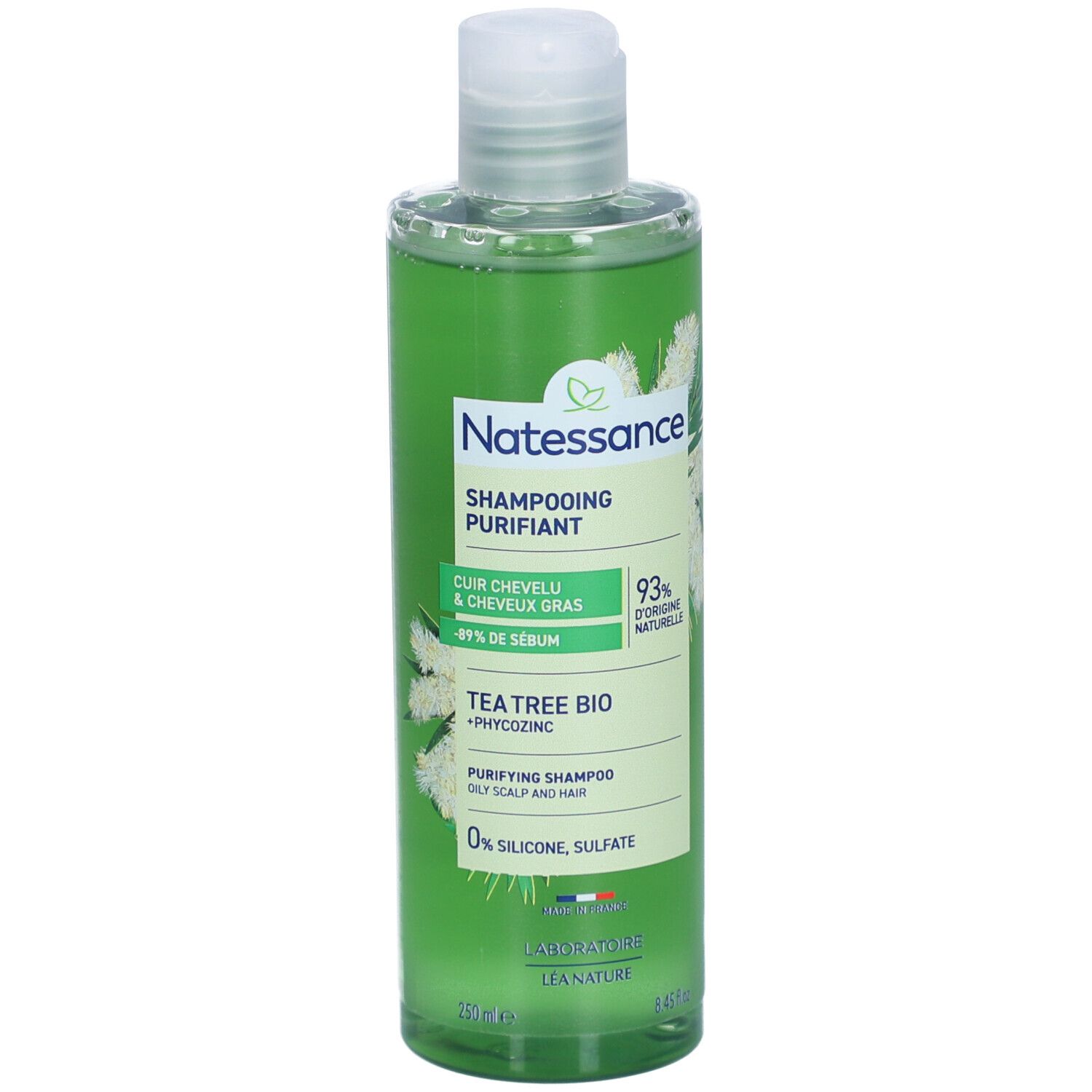 Flacon de shampooing vert. Inscription: Natessance, Shampoing Purifiant, Tea Tree Bio. 93% d'origine naturelle. 0% silicone, sulfate.