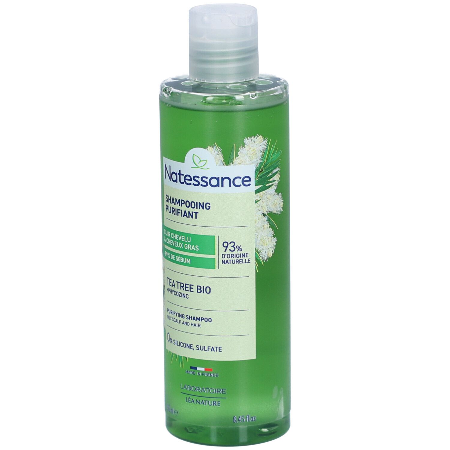 Flacon de shampooing vert. Inscription: Natessance, Shampoing Purifiant, Tea Tree Bio. 93% d'origine naturelle. 0% silicone, sulfate.