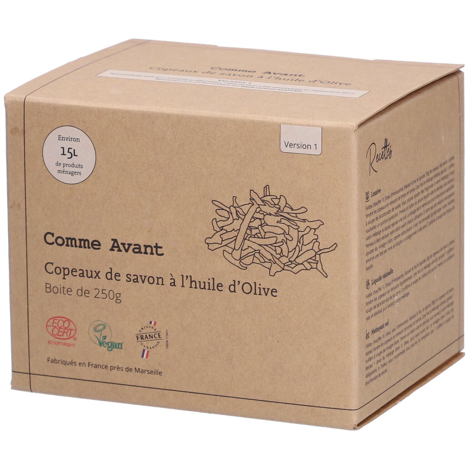 Boîte en carton avec nom et logo du produit. Inscription : Comme Avant Copeaux de Savon à l'Huile d'Olive. Avec certification écologique et label Vegan.