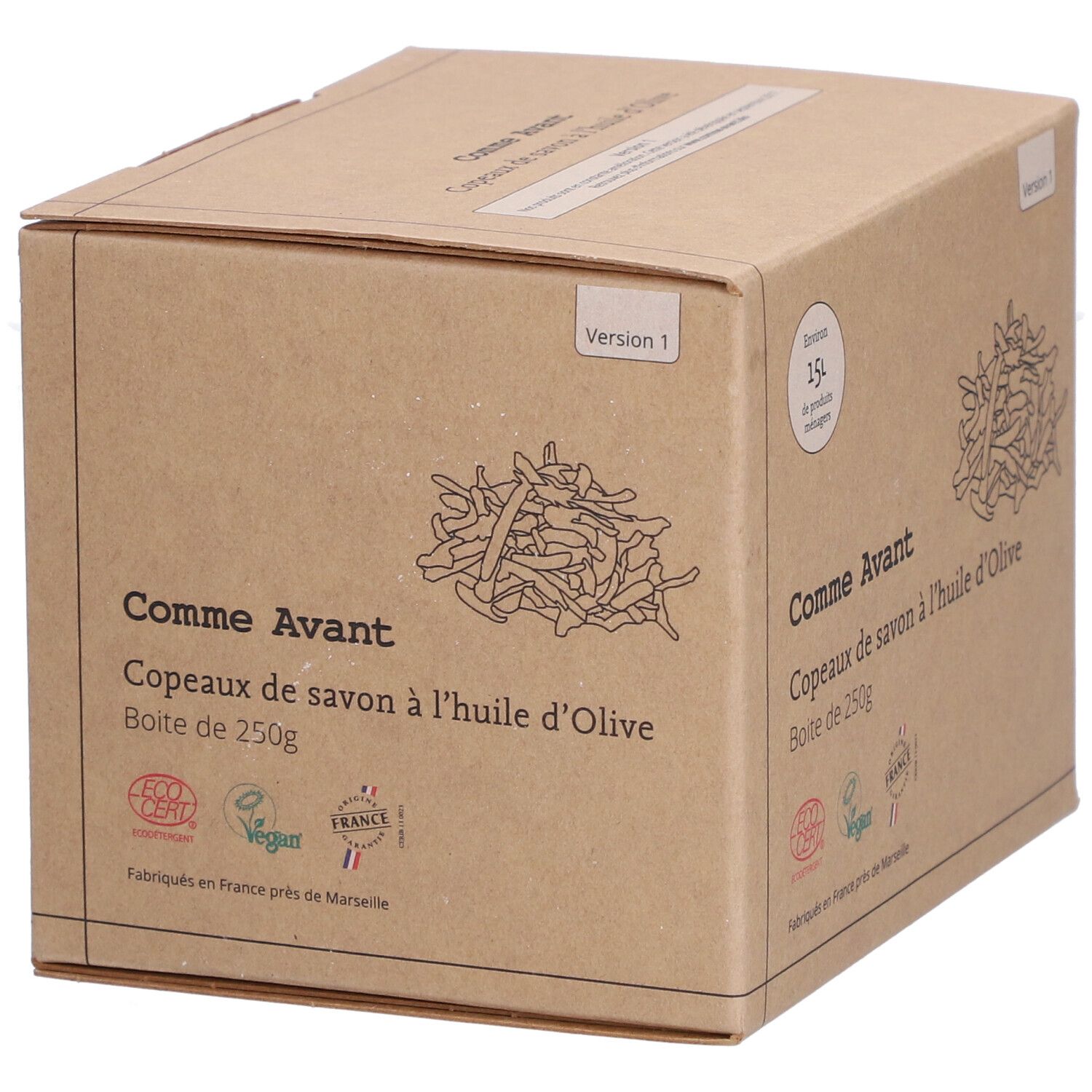 Boîte en carton avec nom et logo du produit. Inscription : Comme Avant Copeaux de Savon à l'Huile d'Olive. Avec certification écologique et label Vegan.