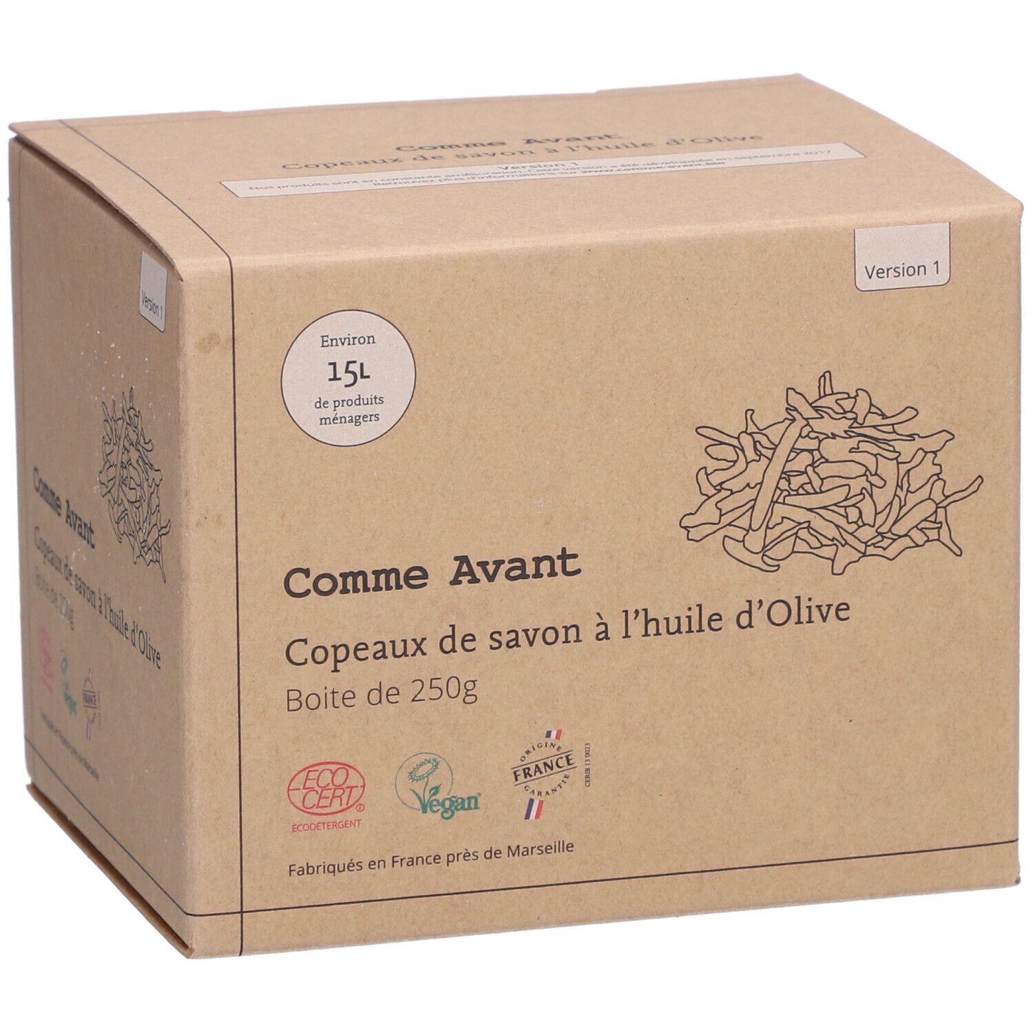 Boîte en carton avec nom et logo du produit. Inscription : Comme Avant Copeaux de Savon à l'Huile d'Olive. Avec certification écologique et label Vegan.