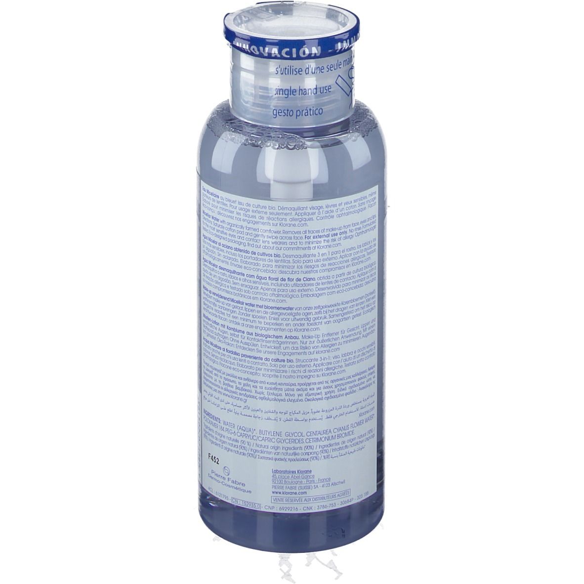 Flacon transparent avec liquide bleu. Étiquette avec texte. Bouchon avec bande bleue et inscription.