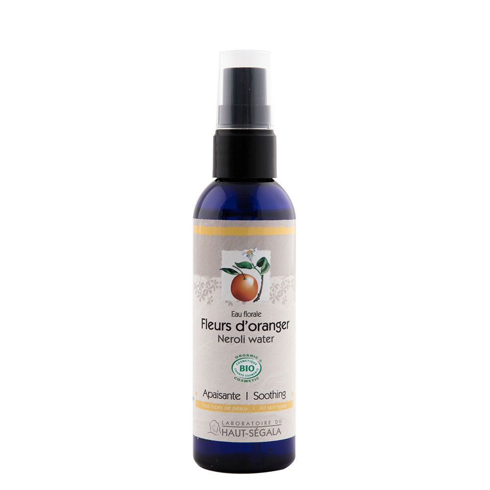 Flacon bleu avec vaporisateur. Inscription: Fleurs d'oranger, Neroli water. Certification bio.