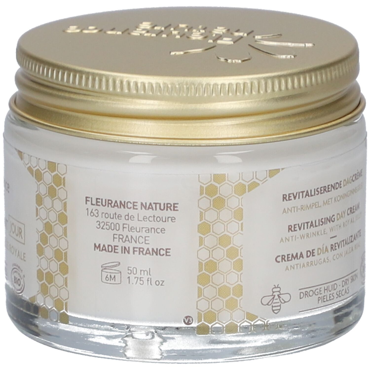 Pot avec couvercle doré. Inscription: Fleurance Nature, 50 ml, 1.75 fl oz. Adresse et origine. Label Bio. Motif nid d'abeilles.