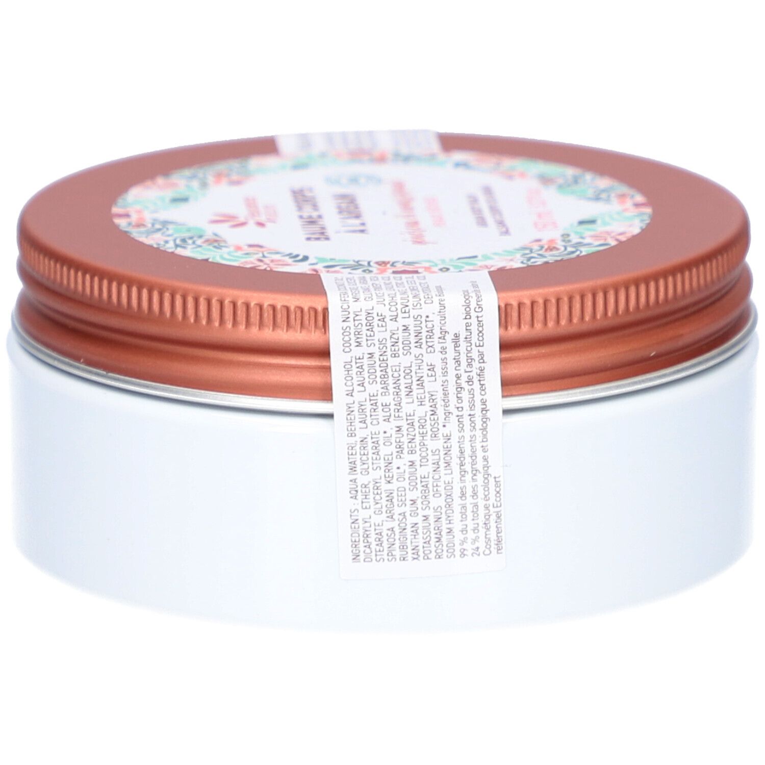 Boîte ronde avec couvercle marron et corps blanc. Une étiquette avec motif floral et texte est présente. Une étiquette avec ingrédients est visible.