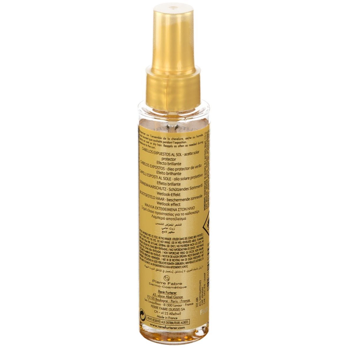 Flacon spray transparent avec bouchon doré. Dos avec texte. Huile solaire.
