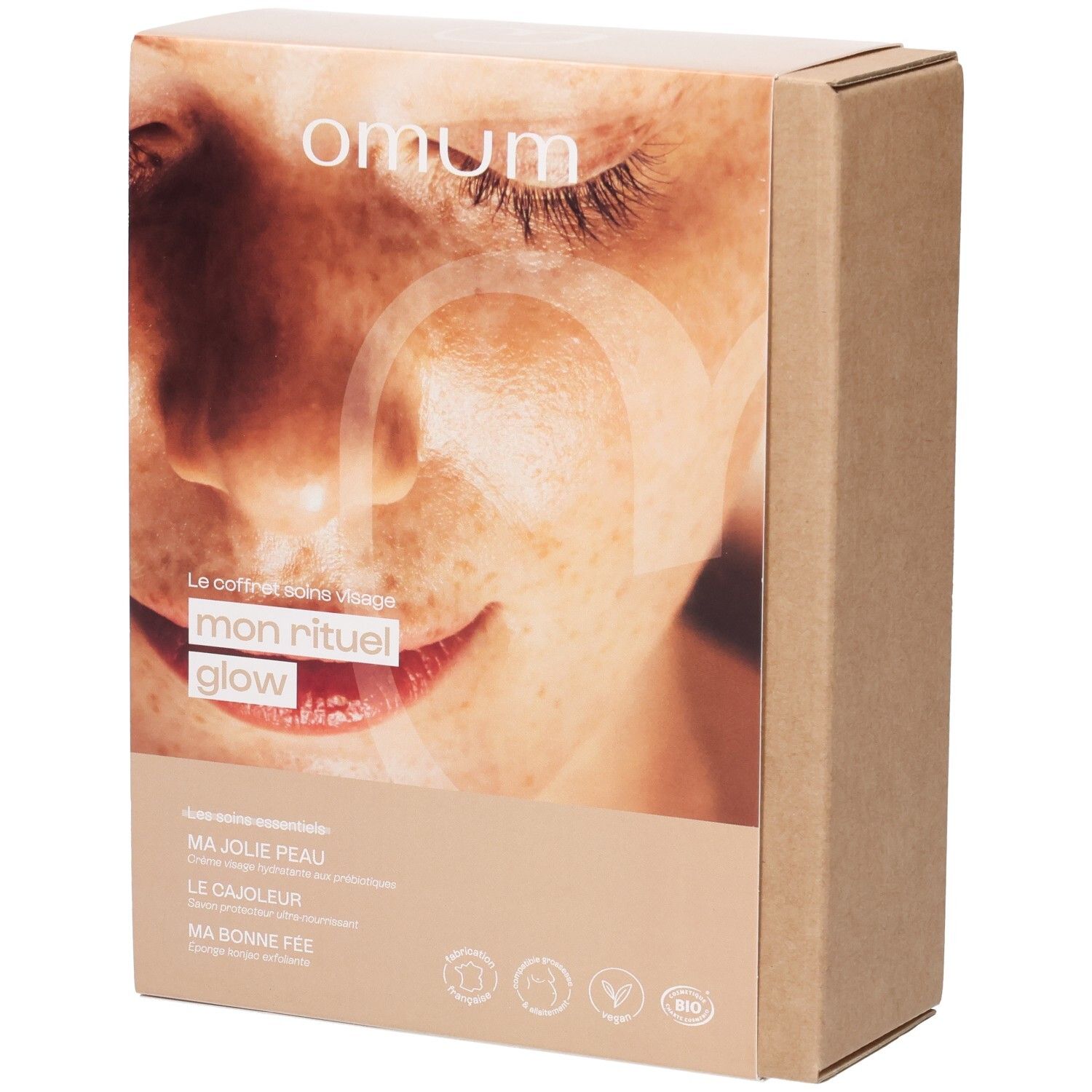 Face avant de la boîte cadeau OMUM 'Mon Rituel Glow' avec image de visage.