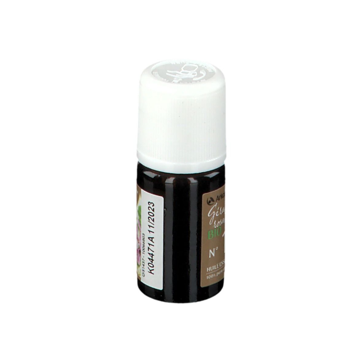 Flacon en verre brun, bouchon blanc. Étiquette avec informations produit et date de péremption.