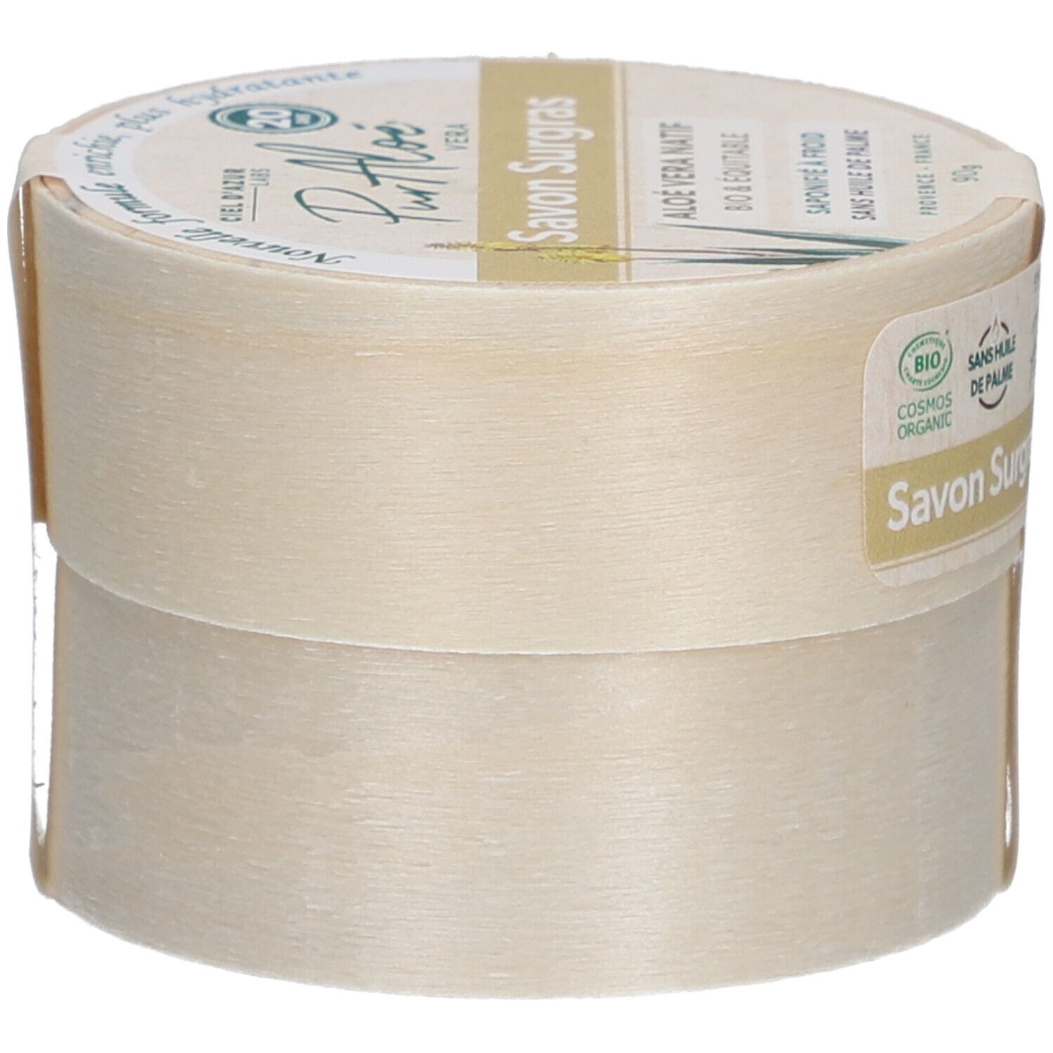Boîte ronde avec "Savon Surgras". Étiquette "PurAloé" et label bio. Vue latérale. Texte : "Nouvelle formule, enrichie, plus hydratante".