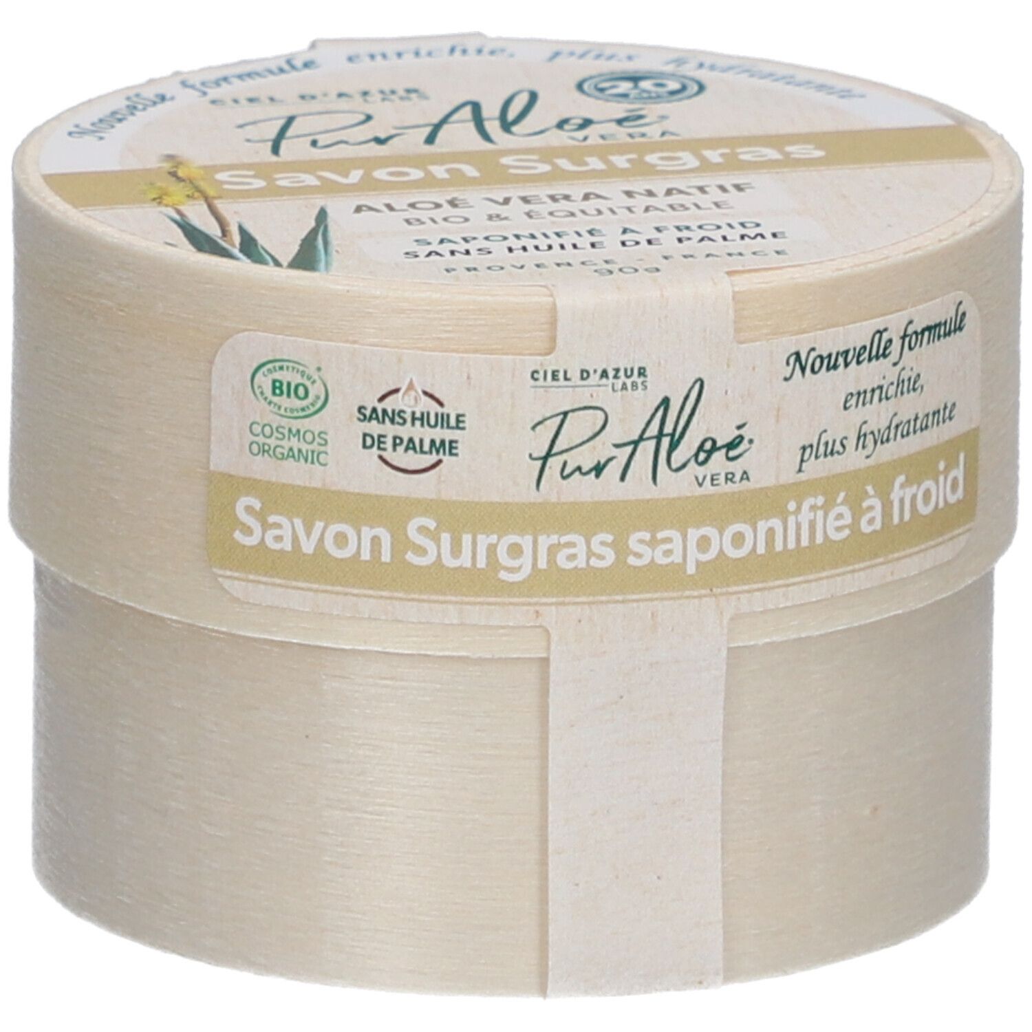 Boîte ronde avec "Savon Surgras". Étiquette "PurAloé" et label bio. Texte : "Nouvelle formule, enrichie, plus hydratante".