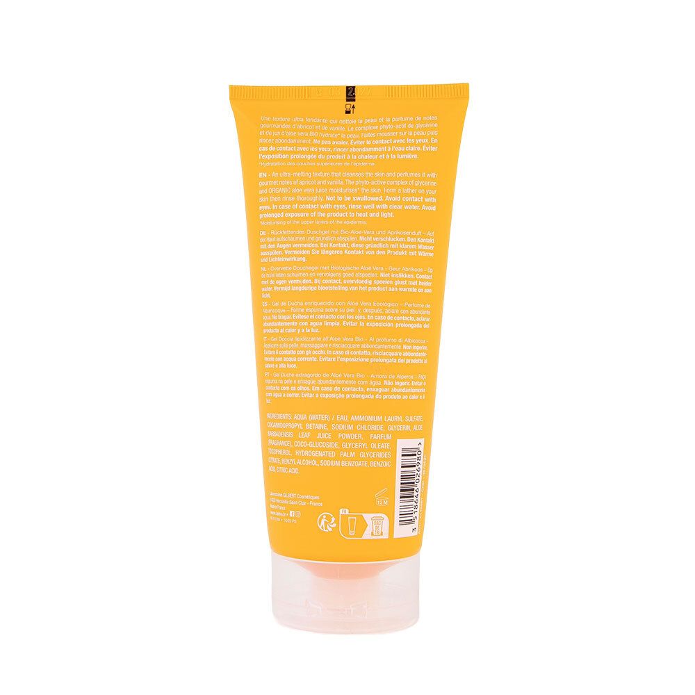 Dos du tube de Gel douche surgras hydratant à l'aloé véra bio abricot. Tube jaune avec texte en plusieurs langues.