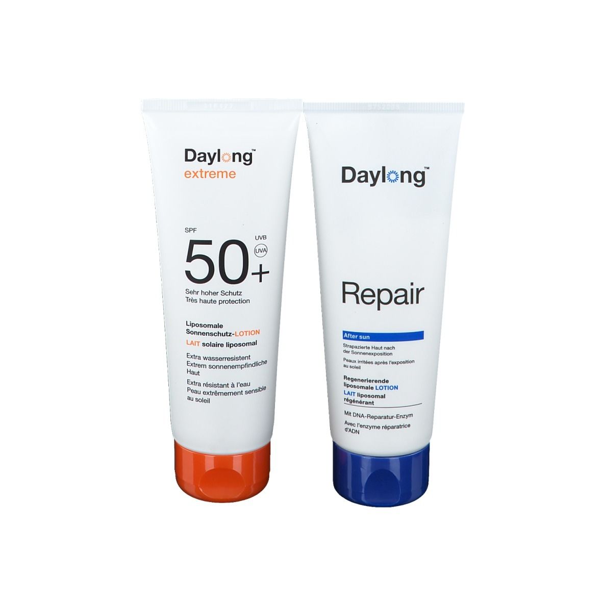 Deux tubes Daylong®. Un avec SPF 50+, l'autre Repair. Blancs avec bouchons colorés et indications de produit.