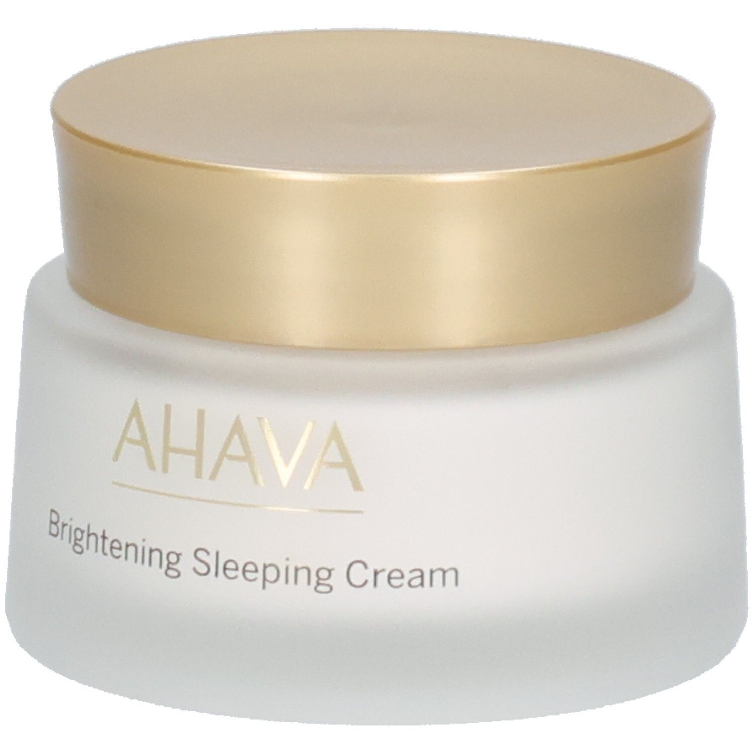 Pot de crème avec couvercle doré. Inscription AHAVA et Brightening Sleeping Cream. Verre blanc dépoli.
