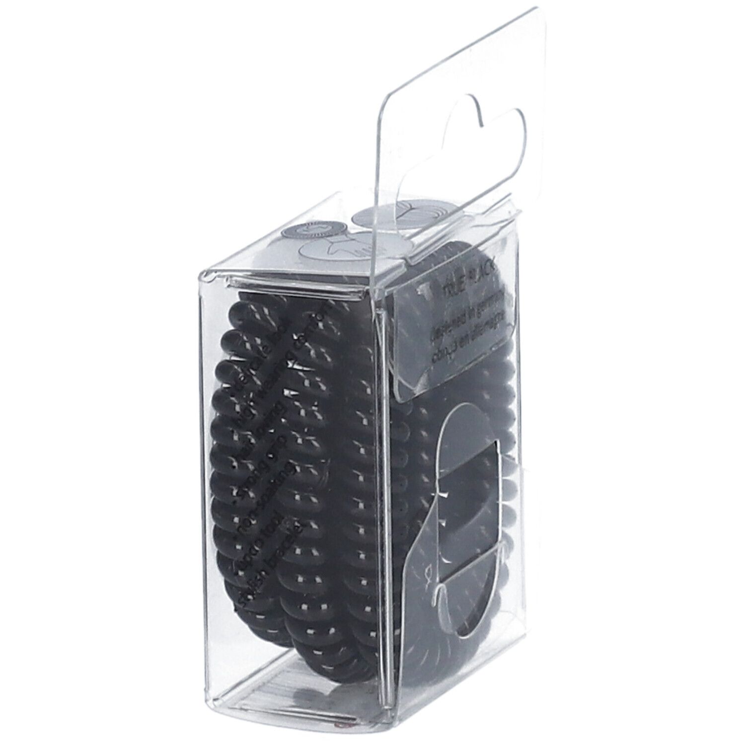 Élastiques à cheveux noirs dans un emballage transparent. Inscription : invisibobble, slim.