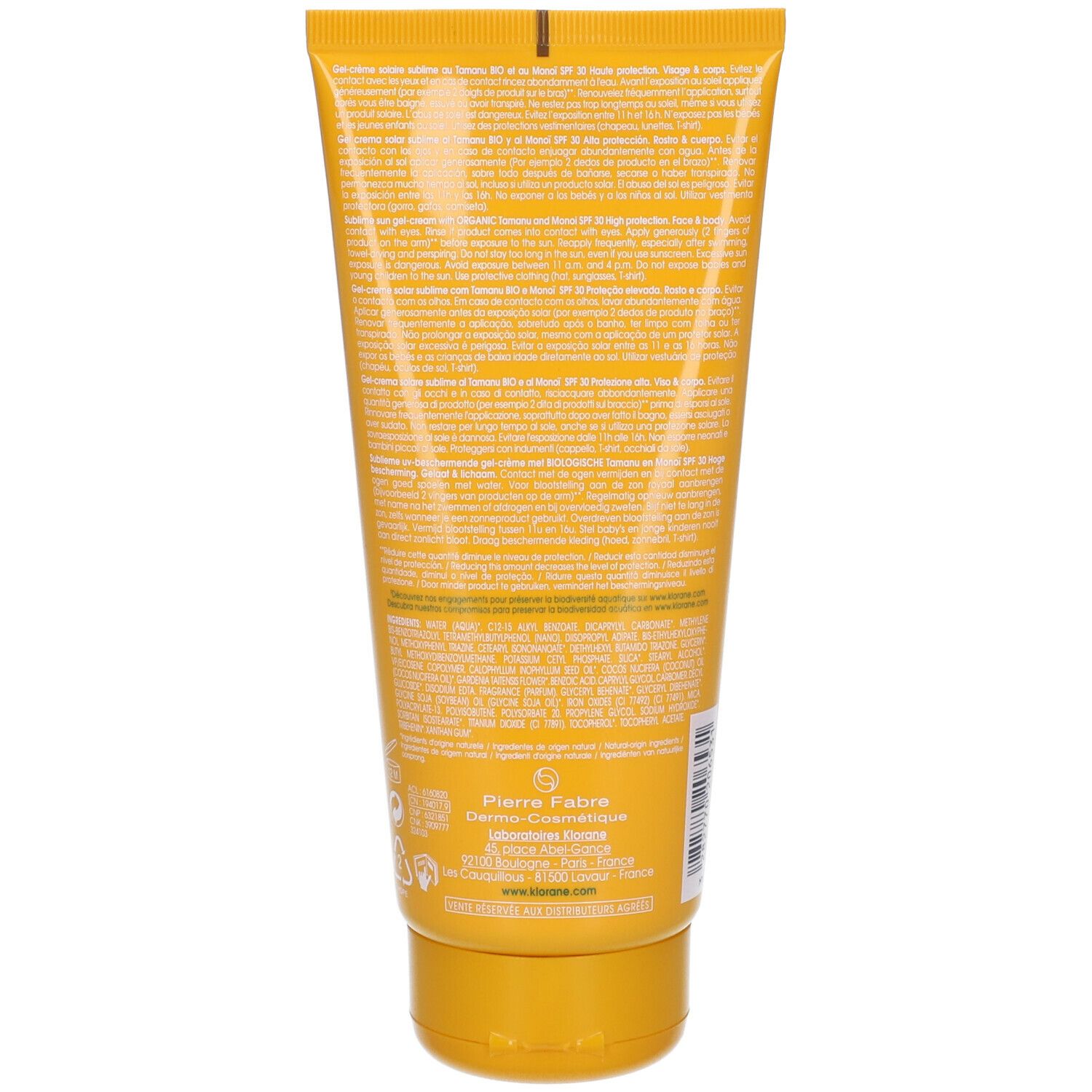 Dos d'un tube jaune avec texte. Informations fabricant et logo en bas.