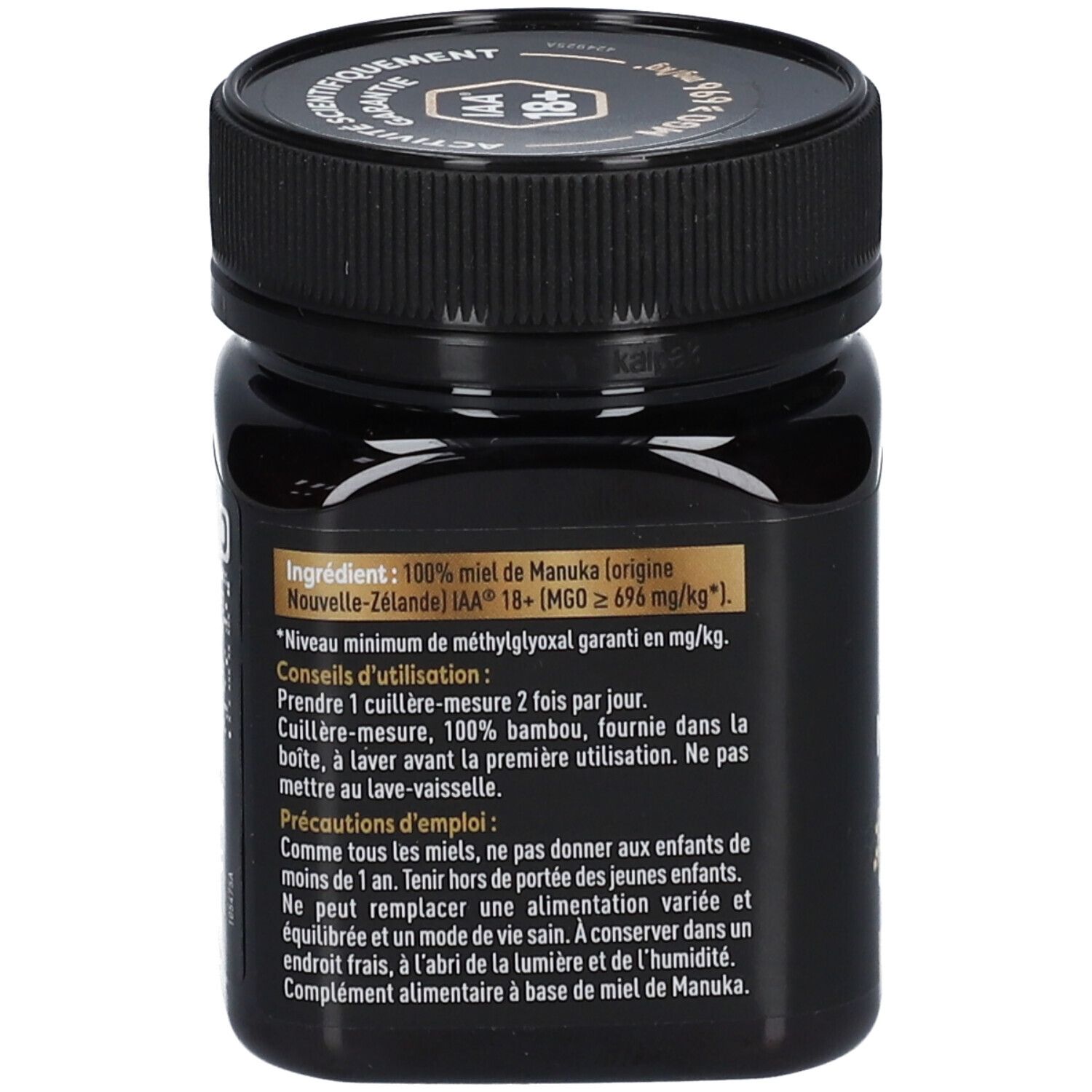 Dos du pot noir de miel de Manuka HUMER. Texte sur ingrédients et utilisation.