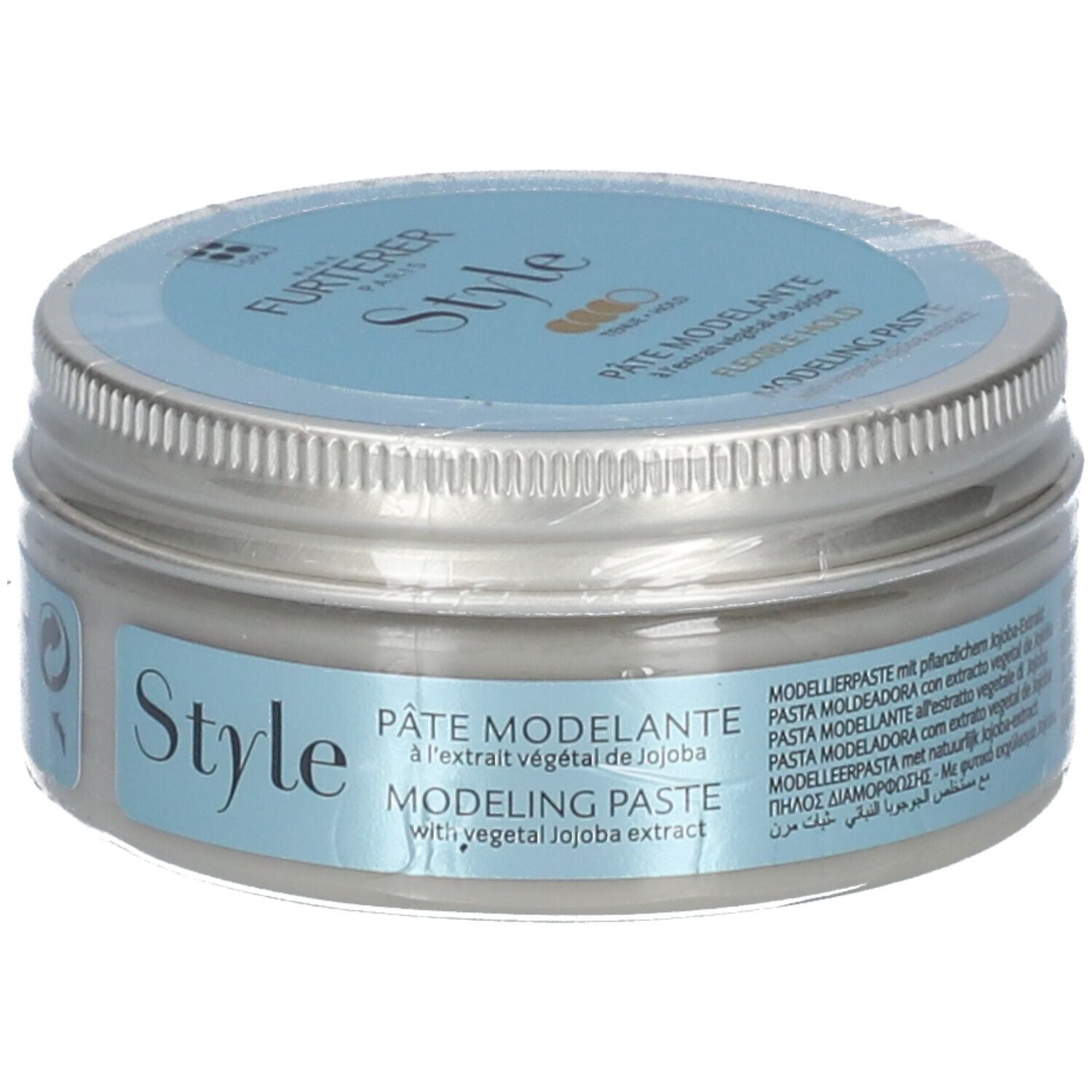 Pot rond avec couvercle argenté et autocollant bleu. Inscriptions "Style" et "Pâte Modelante".