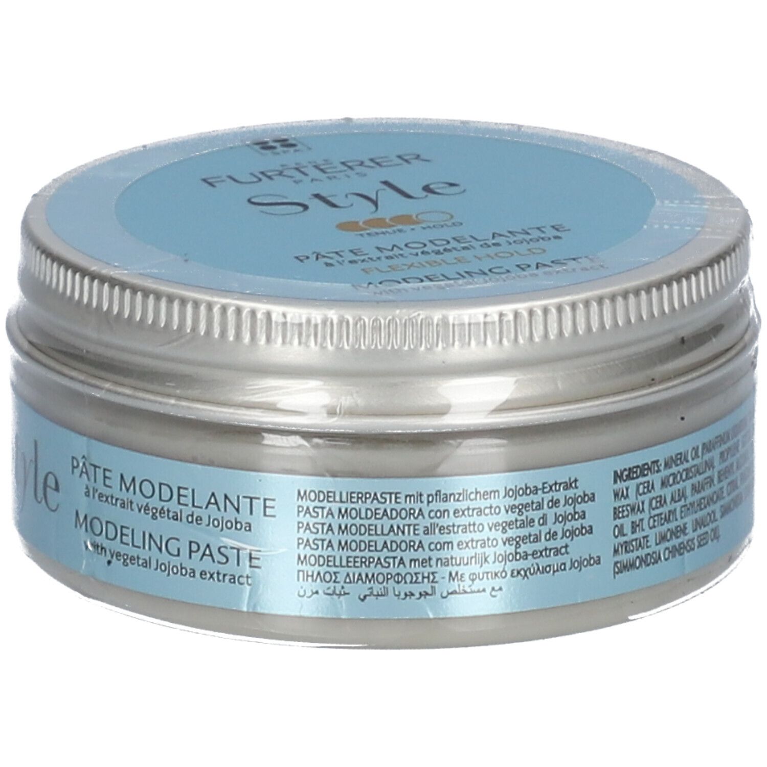 Pot rond avec couvercle argenté et autocollant bleu. Inscriptions "Style" et "Pâte Modelante".