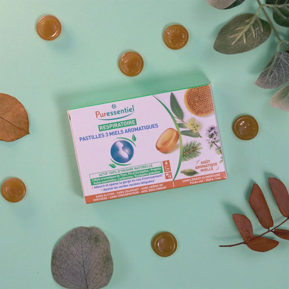 Boîte de pastilles PURESSENTIEL RESPIRATOIRE. 18 pastilles aux 3 miels aromatiques. Vert, blanc, jaune. Sur fond vert.