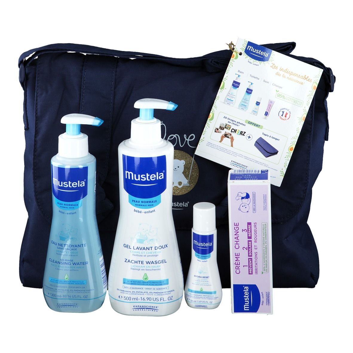 Sac Mustela avec produits : eau nettoyante, gel lavant, crème, lingettes. Brochure et étiquette incluses.