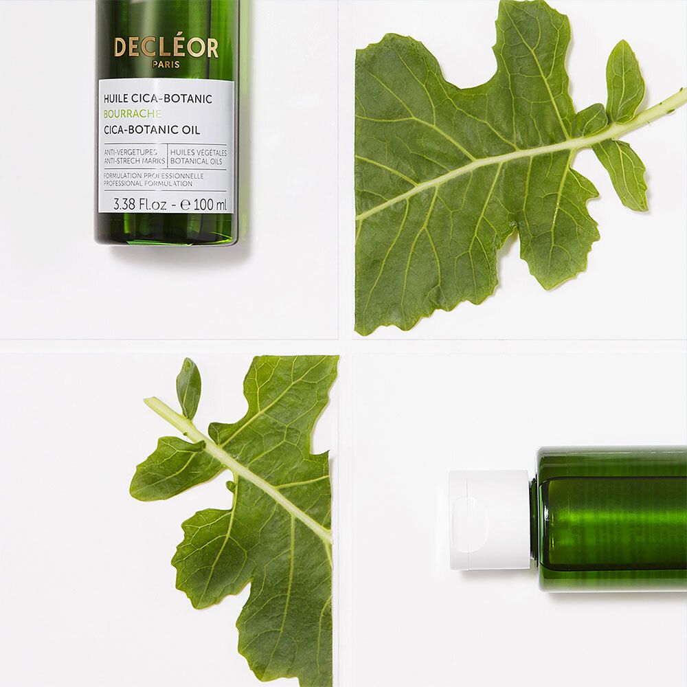Flacon, feuilles. Texte: DECLÉOR, HUILE CICA-BOTANIC. Vert et blanc.