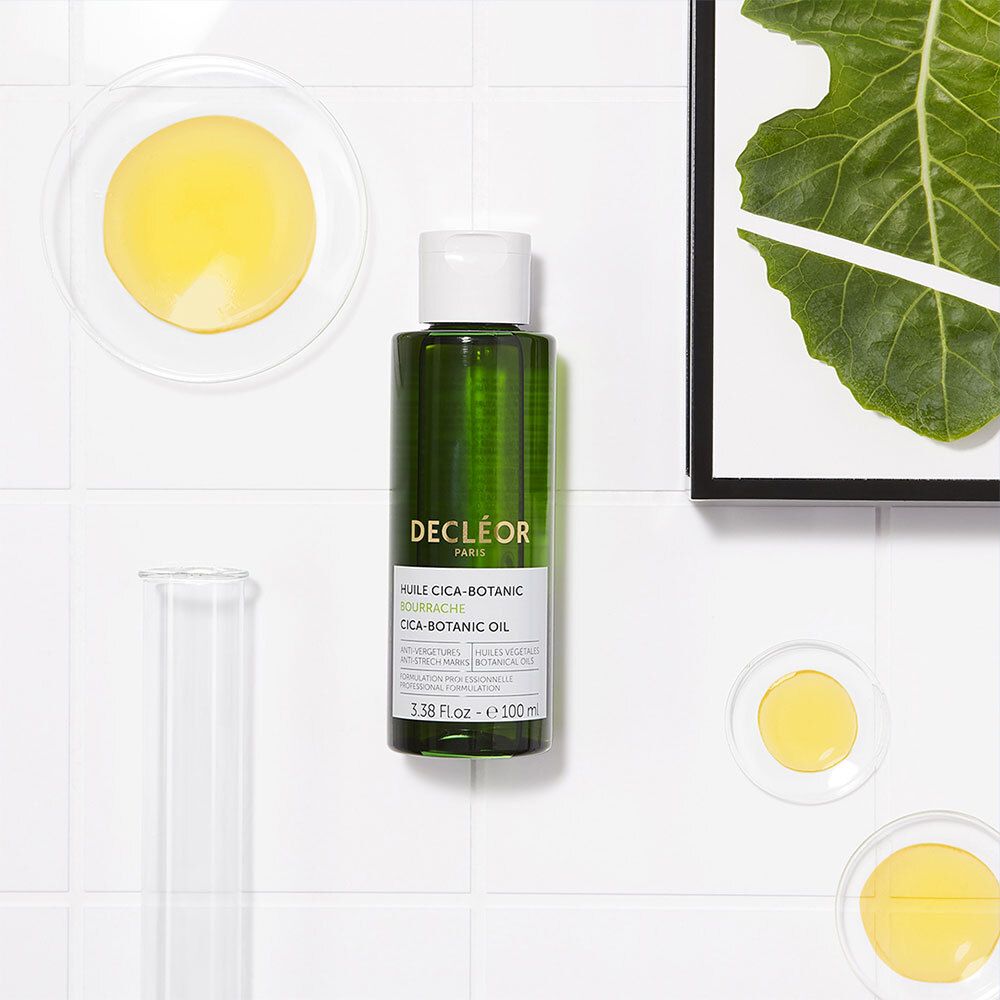 Flacon, huile dans des coupelles. Texte: DECLÉOR, HUILE CICA-BOTANIC. Vert et blanc.