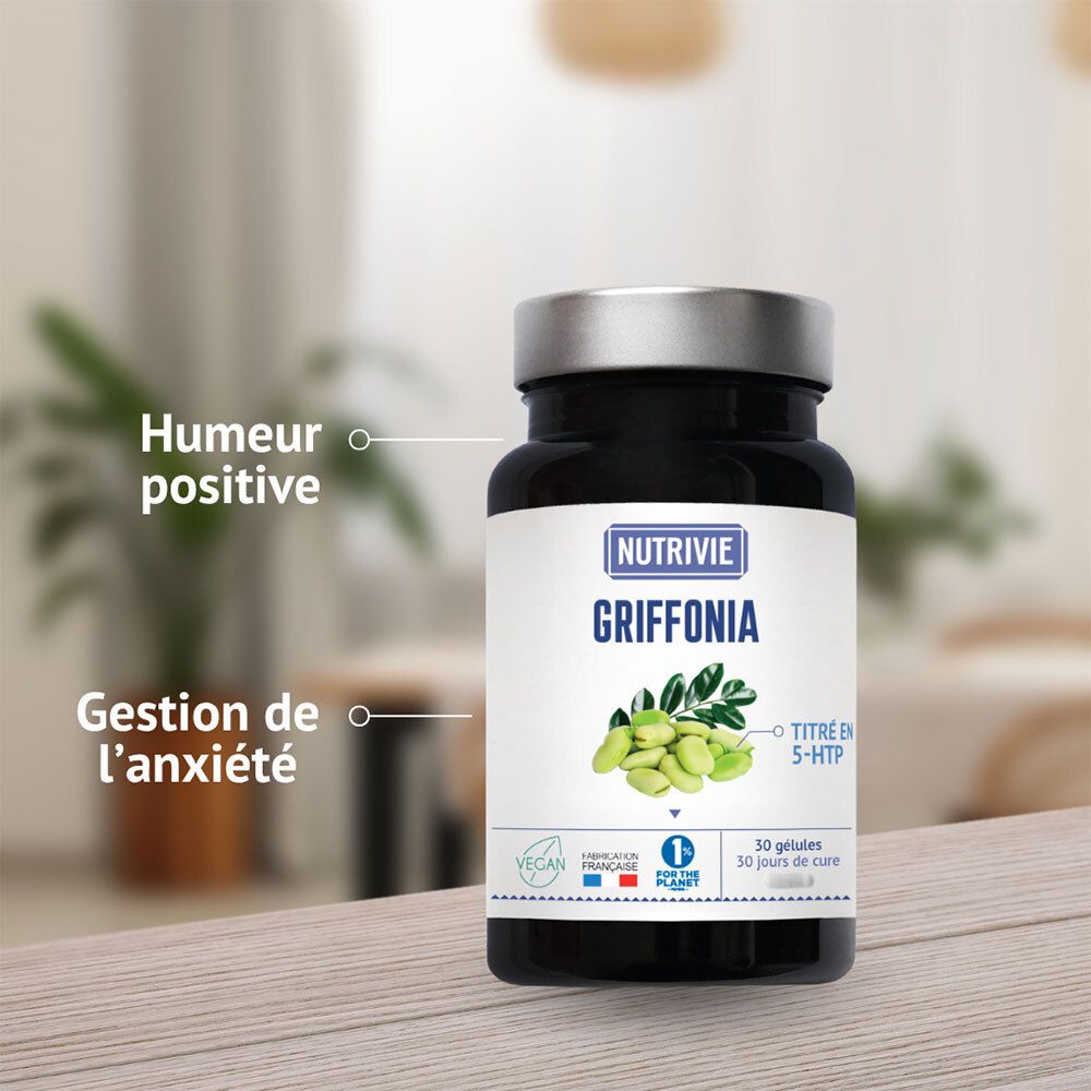 Bouteille de gélules Nutrivie Griffonia sur table en bois, avec bulles de texte sur l'humeur positive et la gestion de l'anxiété.
