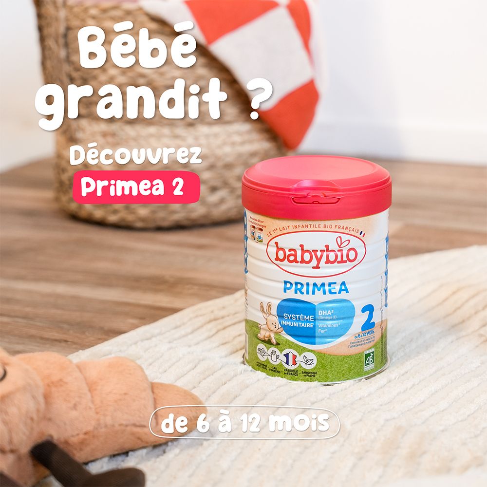 Boîte BABYBIO Priméa 2, 6-12 mois. Couvercle rose, produit sur couverture. Logo, nom, lapin, label AB.