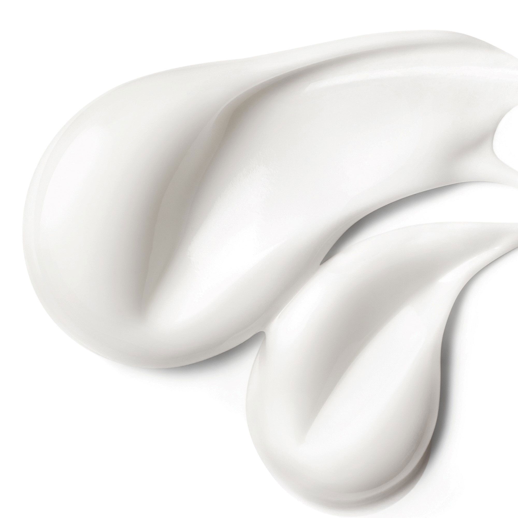 Gros plan sur l'écoulement de crème. Texture lisse et blanche. Pour eczéma atopique.
